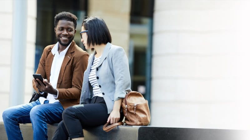 two-employees-outside-an-office - 800x450